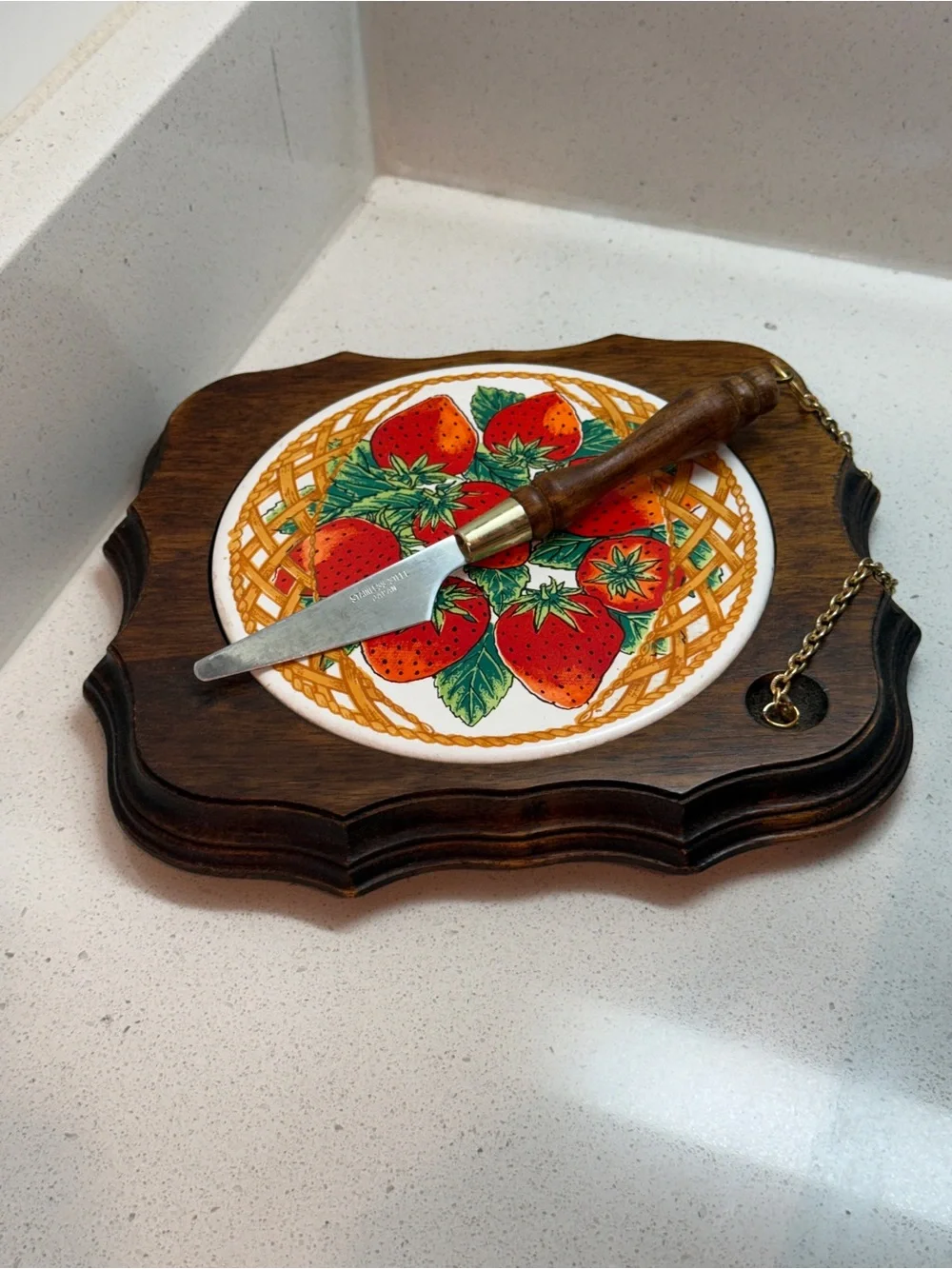 Vintage cheese board with matching knife.